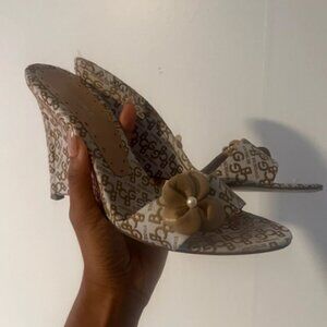 BCBG girls tan and cream wedge monogram heels, with flower detailing.